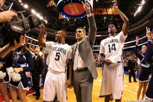 (from left to right) Villanova senior guard Tony Chennault, head coach Jay Wright and freshman forward Darryl  Reynolds salute the crowd after Saturday's win over Georgetown in the regular-season finale. Photo by Webster  Riddick. 
